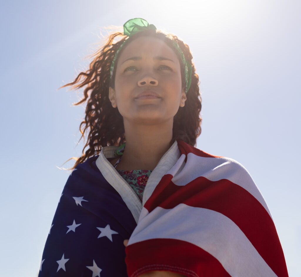 woman wrapped in U.S. flag